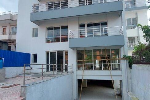 A spacious office building in Jawalakhel with open surroundings, ideal for various businesses.